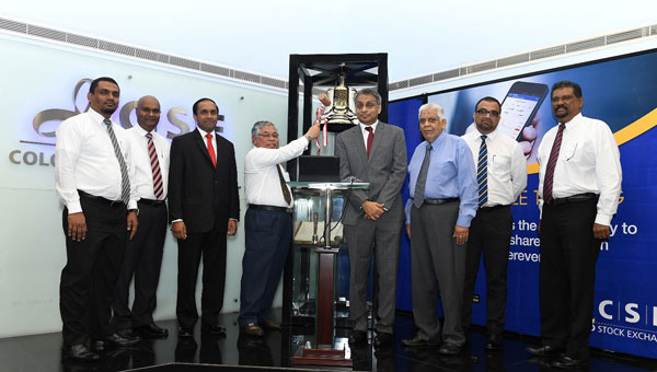 ATLLiferings the ceremonial bell at Colombo Stock Exchange