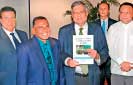 PM presented book  on plantation industry 