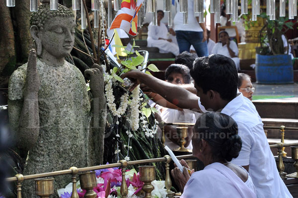 Seeking blessings on Il Poya day