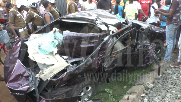 Car-train crash at railway level crossing