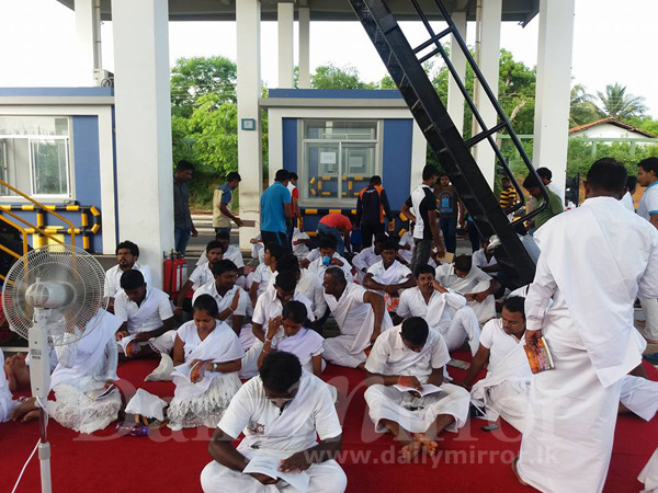 Striking port workers observe ‘sil’