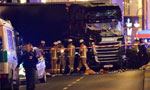 Truck plows into crowd at Berlin Christmas market, 12 dead