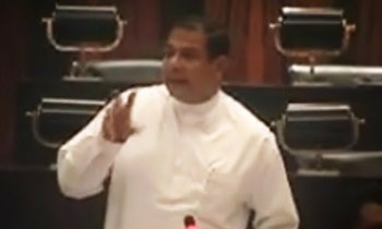 Piyankara Jayaratne sits in Opposition
