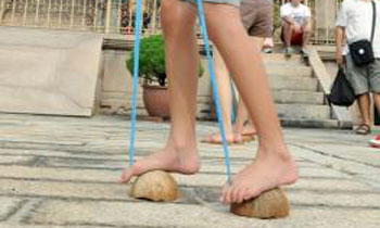 9-year-old dies walking on coconut shell stilts
