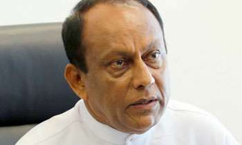 Singapore FTA: SL given visas to 242,000 foreign workers: Lakshman Yapa