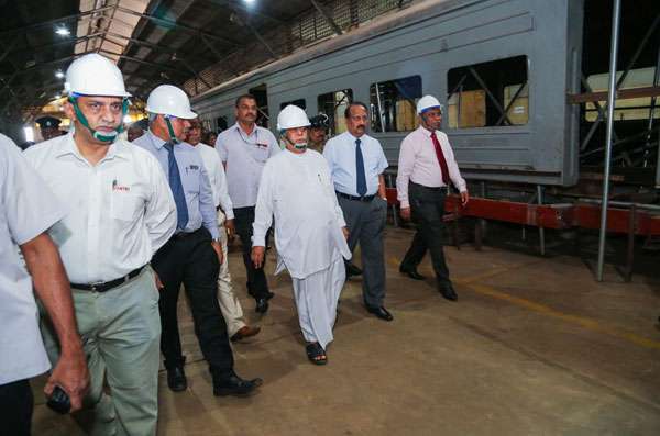 Minister visits factory renovating old train compartments  