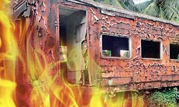 Two train compartments gutted in fire
