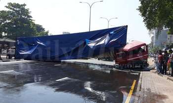 Container topples across Baseline Road