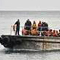 Dozens rescued after asylum boat capsizes