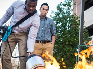 Engineering students extinguish fire with sound